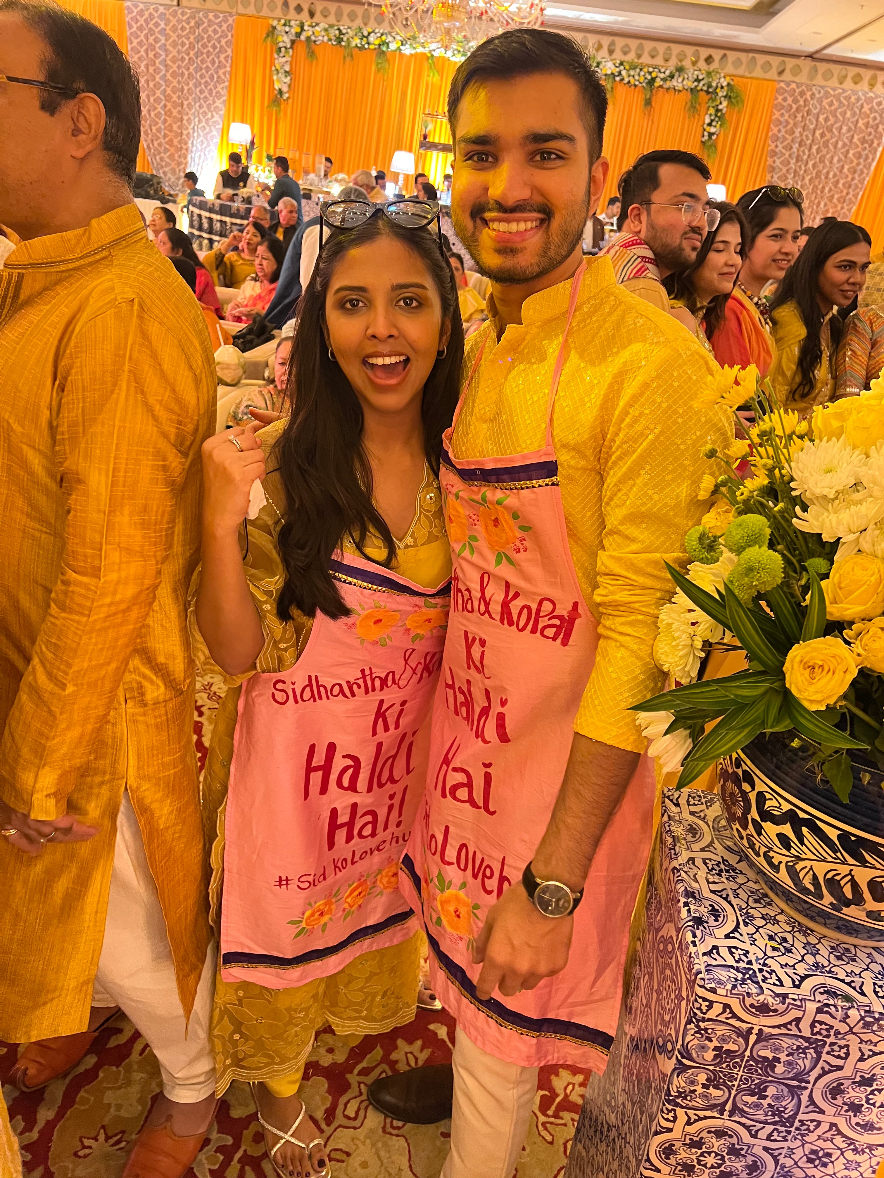 Baby pink apron with couples name + hashtag