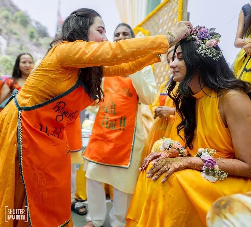 Orange apron with couples name