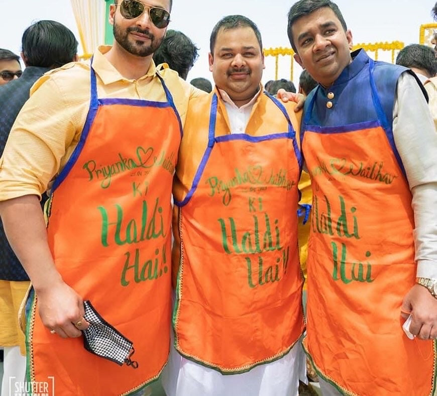 Orange apron with couples name